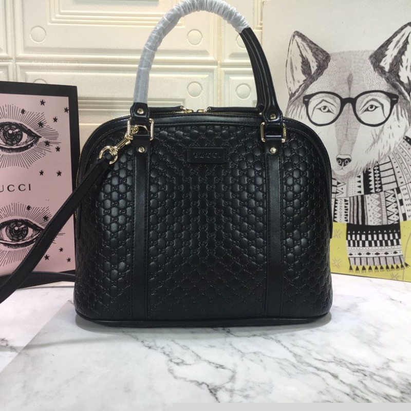 G*u*i top handle bags
